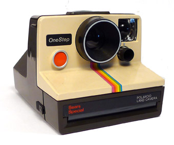 A Polaroid SX-70 OneStep instant camera and Impossible Project